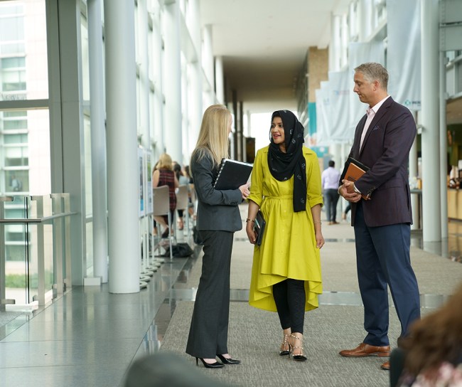 MSD Code of conduct - Diversity of employees walking in hallway
