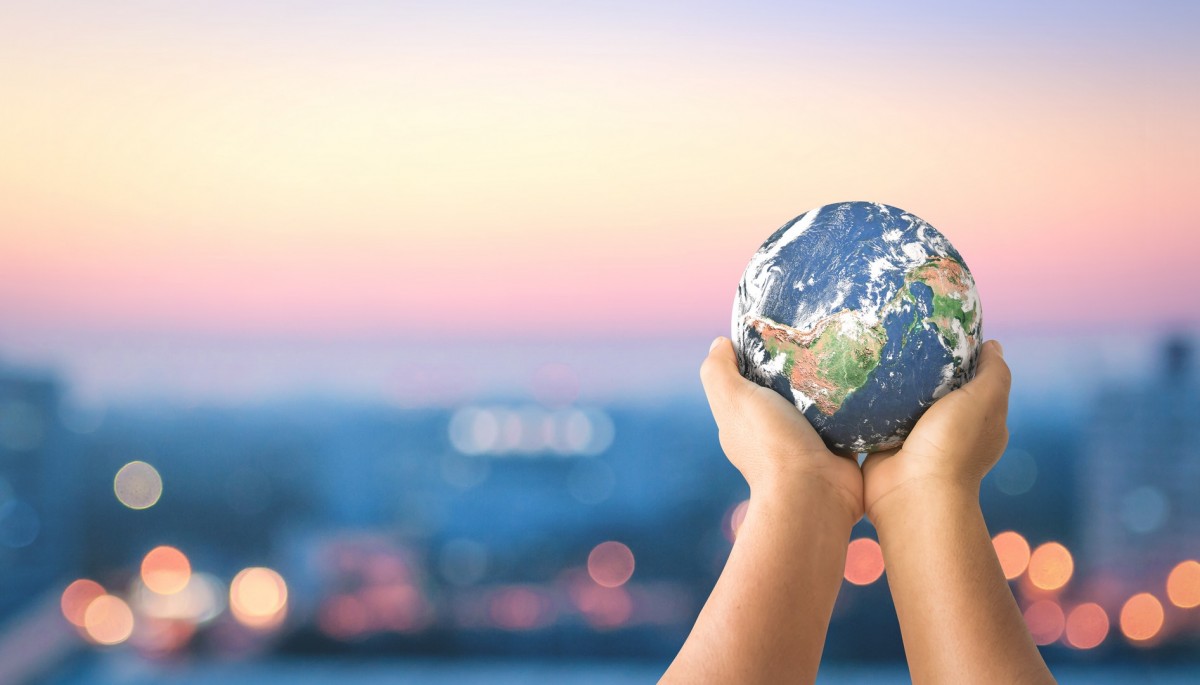 Hands holding planet Earth