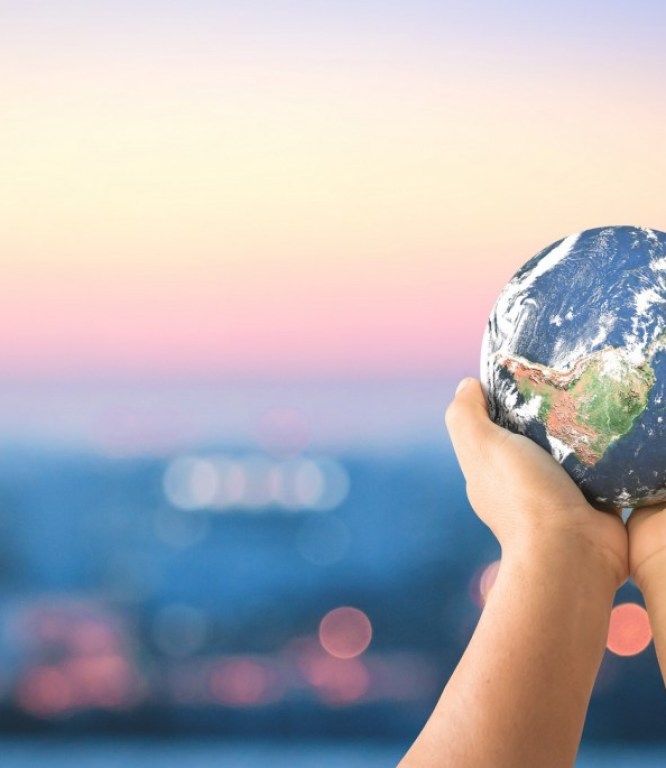 Hands holding planet Earth